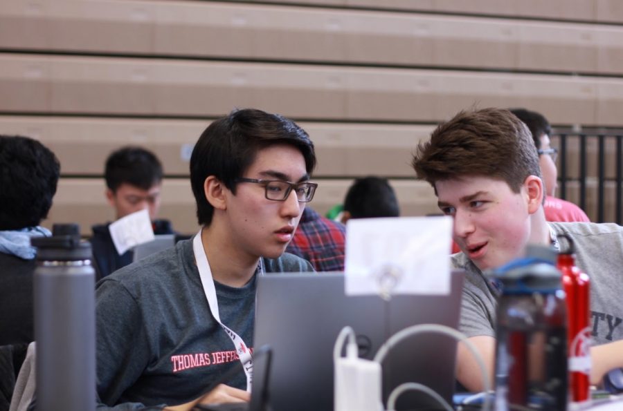 Juniors Daniel Li and David Mead discuss their project while coding at HackTJ. Due to effective planning from the HackTJ team, students like Li and Mead were able to participate in and enjoy this event.