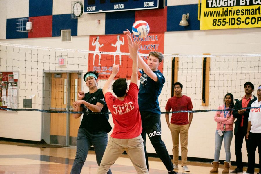 Sophomore Luke Thistlethwaite misses a block and hits the volleyball towards sophomore Aditya Behrani during a March Mania match. Although his team put in a good effort, they were eliminated quickly. “[The tournament] was fine in general but for a $20 entry fee I wouldve preferred double elimination so the [less experienced] teams, like mine, get to play at least two games,” Thistlethwaite said. 