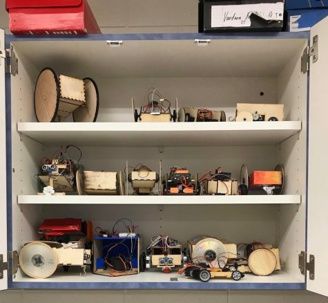 A shelf displays some of the robots built during the past two months. The annual robot project requires freshman to build a fully functioning robot and compete in a rigorous competition.