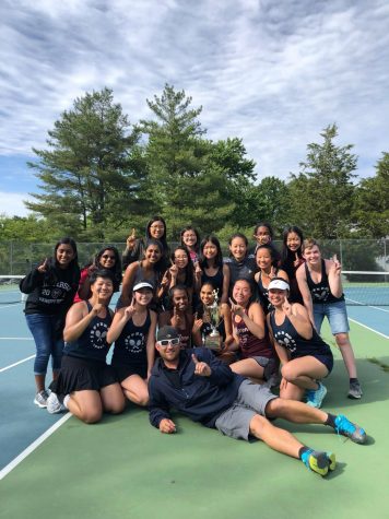 The Jefferson girls' tennis team poses for a photo after their victory at the 5C regional competition. 