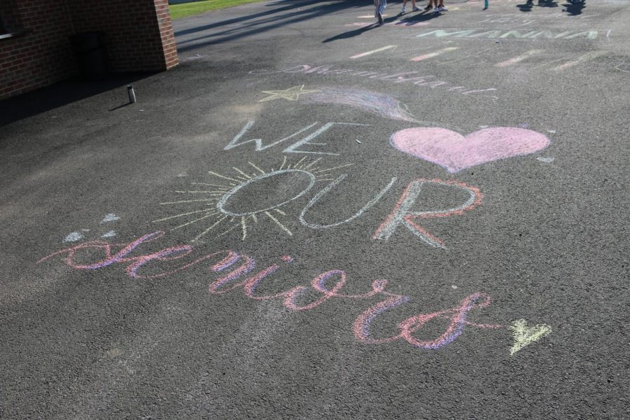 Before their game, the Jefferson varsity girls lacrosse team drew sidewalk art to commemorate senior night.