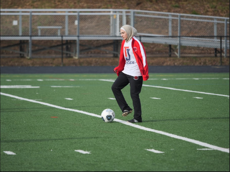 Senior Sabria Kazmi gets ready to play during practice for the girls varsity soccer team.