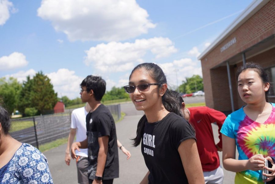Freshman Varshini Subramanian and a few friends head on to the football field to play a game of frisbee and lay on the turf. JDay was really fun, getting to take a break and having fun with friends, Subramanian said.