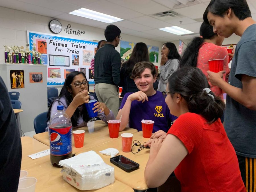 Students enjoy ice cream and the opportunity to socialize at the Latin ice cream social.