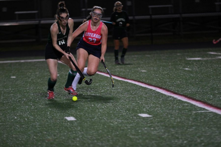 Freshman Ellie Rowland attempts to take the ball from Wakefield. The first goal has been scored by Wakefield, but Jefferson was confident they could catch up. “We weren’t losing by that much so I thought we had it down, like we had an opportunity to win. So I think we were kind of optimistic,” junior Arisa Chue said.
