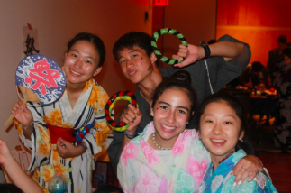 Senior Mia Yang, right, wears a traditional Japanese dress with her fellow campers during the Japanese cultural festival.