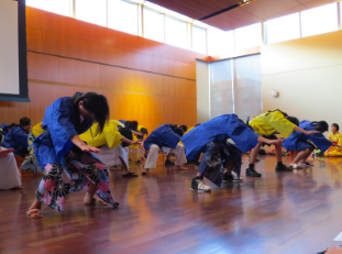 Japanese students perform the traditional dance Sōran Bushi at the Bunka no Hi, the Japanese cultural festival. 
