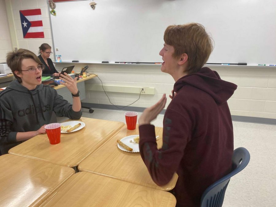 Sophomores Pearson Frank and David French converse while enjoying the refreshments provided at the Thanksgiving Feast. “I enjoyed being able to eat food while hanging out with my friends,” Frank said.
