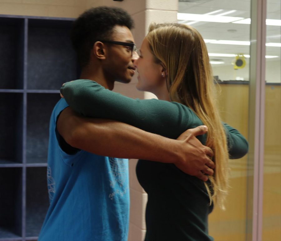 Teaching junior Julia Feldhaus the Viennese waltz, senior Jonathan Daniel guides her around the DaVinci commons. 
