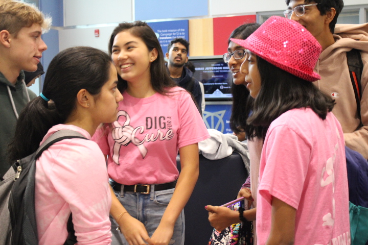 Freshmen Sophia King (middle), Nirja Divekar (right) and Risha Misra (left) among other friends discuss the Pink-Out. All three of them and countless others came together to wear pink in support of breast cancer awareness on Halloween. “There are going to be so many Halloweens throughout our lives,” King said. “This is a very unique cause. It’s more important to wear pink than to wear a Halloween costume.”
