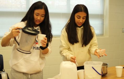 Sophomores Jeanie Qi (left) and Sofia Najjar (right) prepare ice cream and milkshakes to sell to the students browsing the marketplace. “I went to the first [FBLA] meeting last year, and that was fun and I’m interested in marketing and business so I stayed at marketplace,” Najjar said. “We sold milkshakes and brownies, and we ran out of everything really quickly, so we just sold as much as we can.”
