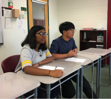 Freshmen Shriya Muthukumar and Matthew Kim, ready to answer the questions, listen to the question the moderator is asking during the preliminary round of the kickoff. “It was great since despite the fact we only got two people on the team, we still got third place,” Kim said.