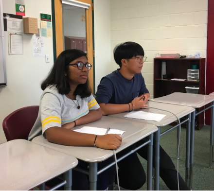 Freshmen Shriya Muthukumar and Matthew Kim, ready to answer the questions, listen to the question the moderator is asking during the preliminary round of the kickoff. “It was great since despite the fact we only got two people on the team, we still got third place,” Kim said. 