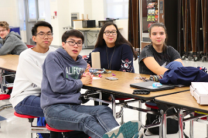 From left to right, seniors Joshua Ngyuen, Kevin Du, Zoë Gomez-So and Grace Cullen wait in anticipation for the answers to be read out loud.
