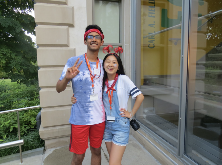 Senior Mia Yang poses alongside junior Vikram Raghu, both decked out in red, white, and blue.