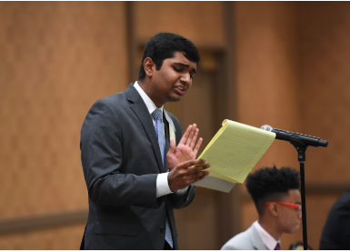 At the 2019 National Speech and Debate Association National Tournament, senior Manu Onteeru speaks passionately to a panel of judges about data privacy and stricter government regulations. Photo by Grace Rogers.
