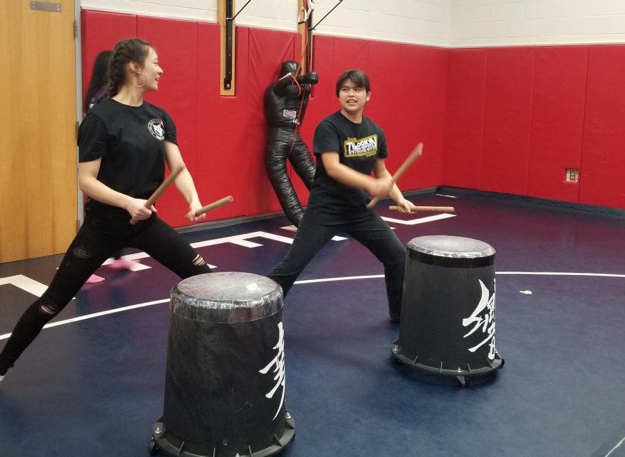 Sophomores Alyssa Rask (right) and Alana Nii (left) perform a taiko routine as a duet. “I love the program here at TJ because it’s very relaxed. I also do taiko outside of school, and my experience with the taiko community is just - there’s a lot of fantastic people,” Nii said.