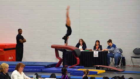 Echano does a front handspring on vault. “On vault, I am doing a new, different skill than when I was competing in club. And the one I do now scores higher, so thats cool,” Echano said.