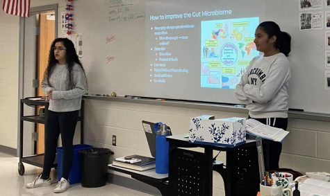 Juniors Gurleen Kaur and Neha Sripathi present about the gut microbiome at a club meeting. The gut microbiome is one of many specific aspects of microbiology that the officers hope to explore in depth. “The gut microbiome is something thats really interesting, [such as] how it impacts your physical and your mental health,” Kaur said.