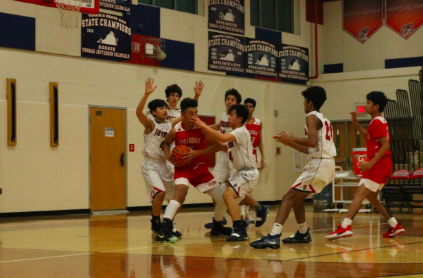 The Jefferson team hovers over the Annandale player trying to get back on the lead as they attempt to block him from making a pass. “We should never get too overconfident and we should continue playing aggressive,” sophomore Vinay Gundu said. 