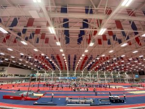 The Liberty University Indoor Track Complex bustles with students, coaches, and parents during the Liberty Premier Invitational meet.