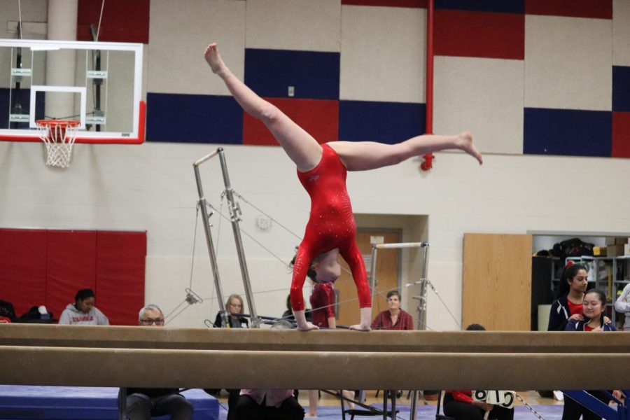 Sophomore+Micaela+Wells+performs+her+beam+routine+at+the+gymnastics+meet+in+Jefferson.