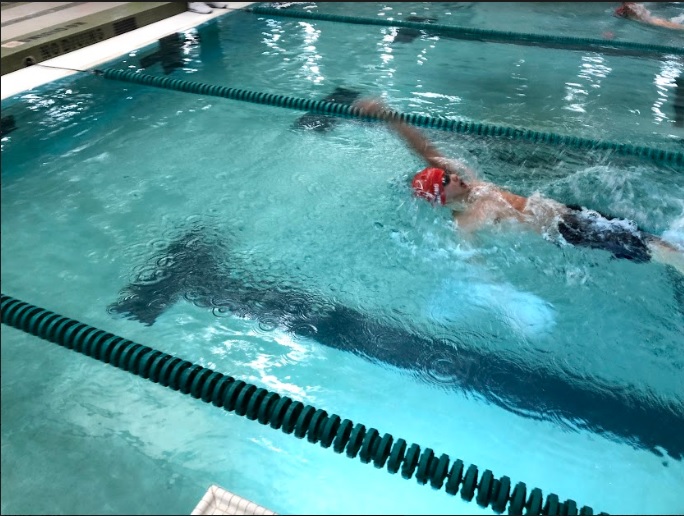Freshman Athan Zhang swims at the dual meet against Wakefield on Friday, Jan. 17. Optimism ran high during the meet, and the team pulled through with a decisive victory. “I think TJ is a pretty strong team - I think we have a pretty good chance today,” sophomore Sarina Saran said.
