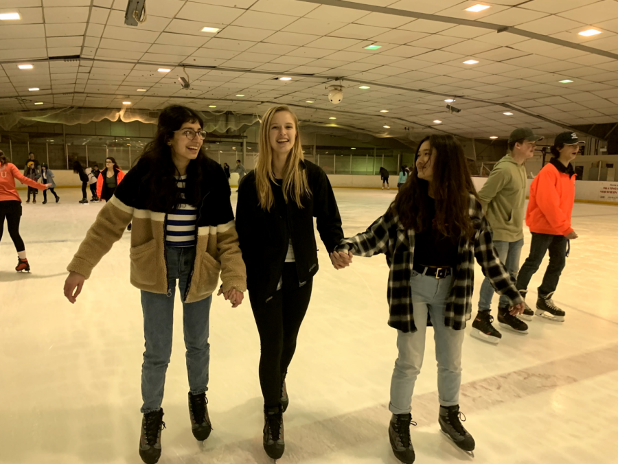 Juniors Kashika Danjal and Julia Feldhaus and sophomore Faith Wu smile while skating together. “I loved being able to hang out with my friends in a non-school setting,” Wu said.