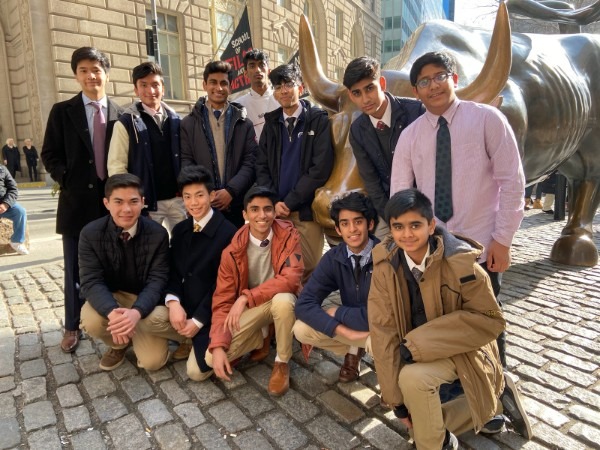 The investment club members pose in front of the "Charging Bull" statue near Wall Street. "The bull has captured tourists’ imagination," Business Insider said. The 7100-pound statue is said to symbolize brazen optimism among investors.