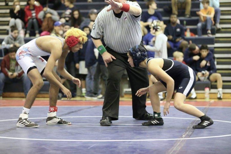 Junior Brianna Ta competes in a match during the districts meet last year as a sophomore