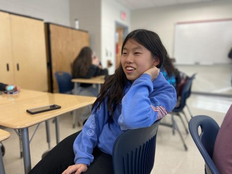 Freshman Sophia Lee converses with a friend during the soccer interest meeting on Feb. 25.