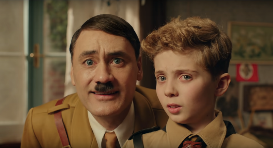 Imaginary Hitler (Taika Watiti) advises child Jojo Betzler (Roman Griffin Davis) before he attends Hitler Youth training camp. This scene serves as a setup to what happens in later stages of the movie. 