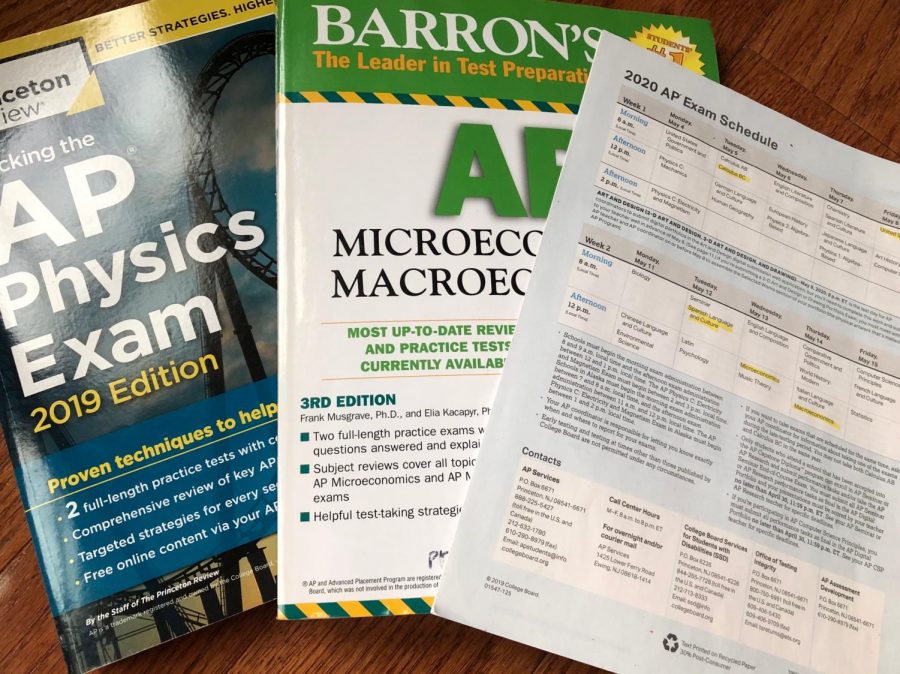 The old 2020 AP exam schedule along with an AP Physics prep book and AP Micro/Macroeconomics prep book. The changes to the 2019-20 AP exam administration are a concern for some. "I think the main concern most people have is how colleges are going to take this entire situation," Granum said. 