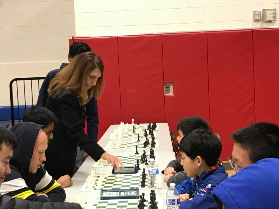  Dr. Ann Bonitatibus makes the first move for senior Praveen Balakrishan, who placed first at the tournament. ”It is usually customary for a famous person to start off a chess tournament by making the ceremonial first move on the top board. As States was held at TJ, I was delighted when principal Dr. Bonitatibus made the first move for me at the beginning of the tournament.” Balakrishnan said.