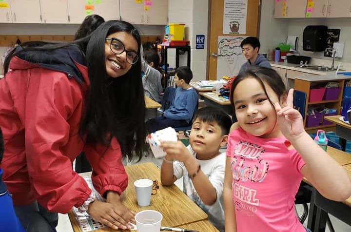 Senior Anoushka Sarkar guides Weyanoke Elementary students through a chromatography lab.