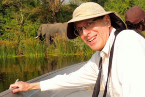 Mr. William Young poses for a picture while on a birding trip in Africa. "I find birding to be valuable because it gives you a closer view of nature," Young said.