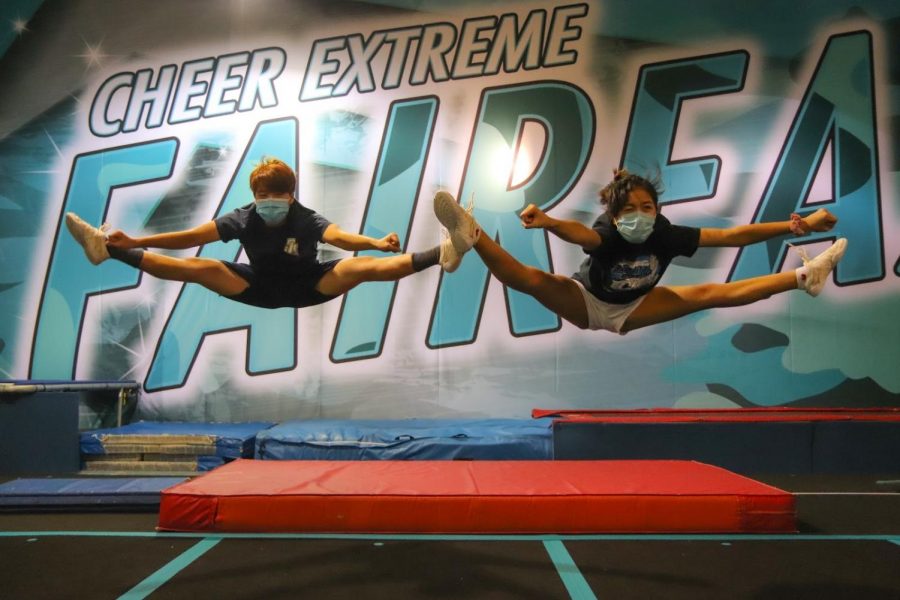 Performing straddle jumps at Cheer Extreme Fairfax, seniors Matthew Hwang and Jenalyn Dizon attend one of their weekly tumbling practices (9/14/2020). To maintain safety protocols while developing cheer skills, these practices hold only about five students, all of whom must wear masks. “Tumbling practices really help the team with their abilities, and it’s so nice to see other team members, even if it isn’t the entire team,” Dizon said.