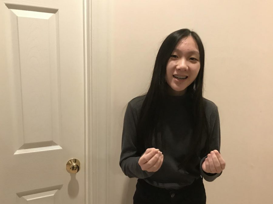 Junior Grace Kang practices her poem, “The Well Rising,” by Willam E. Stafford at home in preparation for her English class’s Poetry Out Loud competition. 