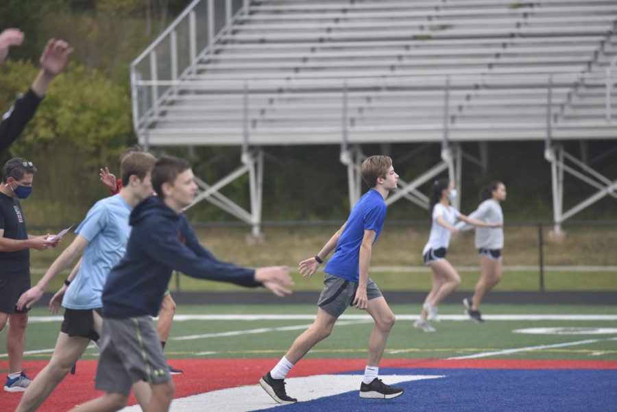 Jefferson Track & Field athletes warm up during their socially distanced practice. “I cannot wait to get back to competing,” junior Ignacio Toro said. “It is a lot more fun trying to reach your goals when you have people there to motivate you.”
