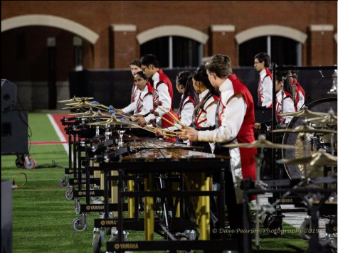 Jefferson’s marching band front ensemble gets set up and ready to play at one of their concerts during the 2019 season.