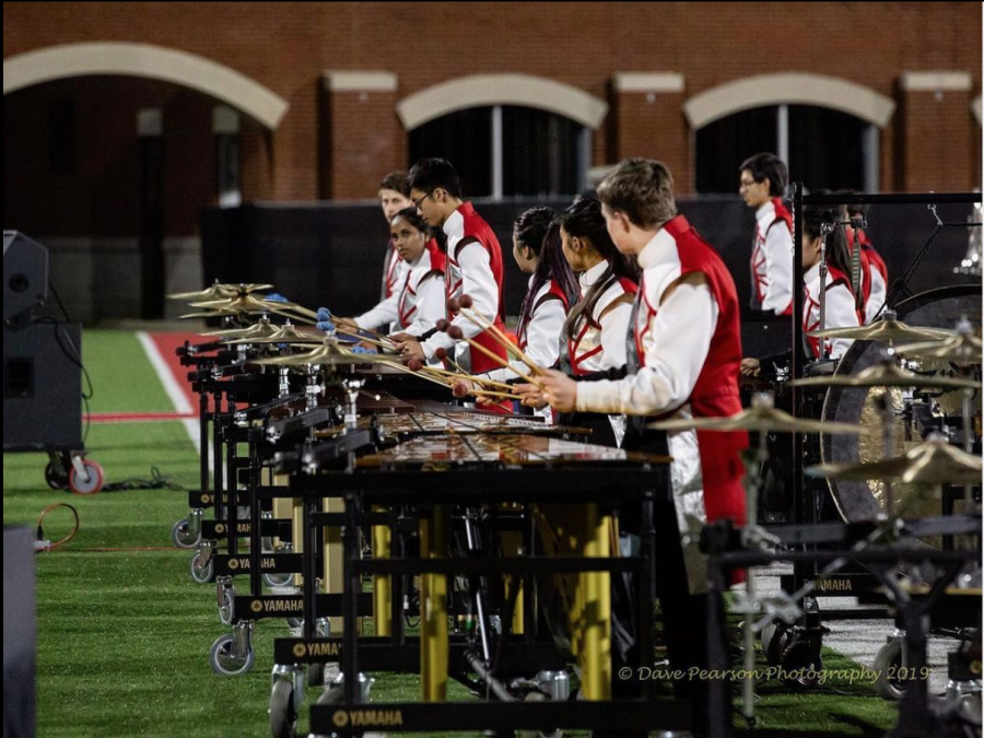 Jefferson%E2%80%99s+marching+band+front+ensemble+gets+set+up+and+ready+to+play+at+one+of+their+concerts+during+the+2019+season.