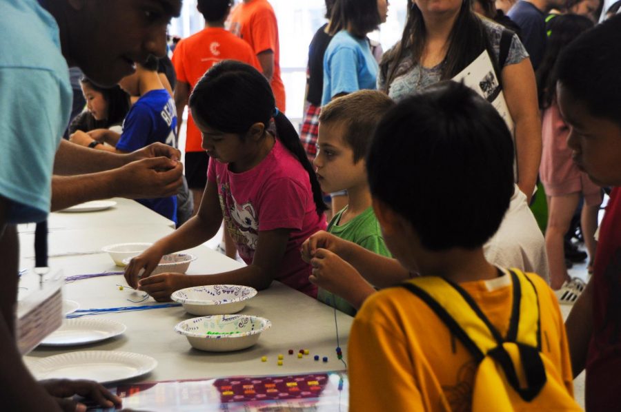 Children participate in a demonstration at Techstravaganza 2019. The 2020 Techstravaganza team hopes to emulate these experiences online in a virtual environment.  “We want all of the kids to get the same experiences like if the event were still physical,” Du said. 

