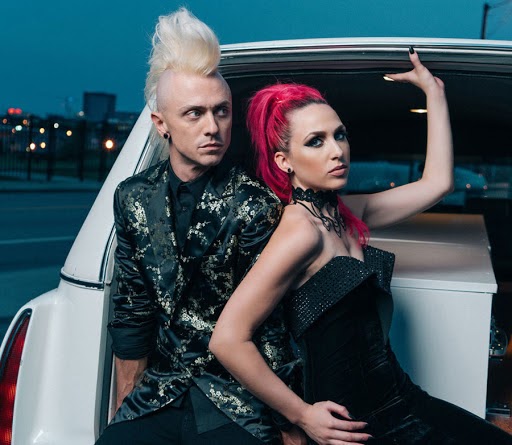On the left is Shawn Jump, the duo's guitarist, and on the right is vocalist Ariel Bloomer. The two are the members of Icon for Hire.