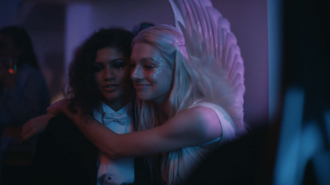 The two charismatic leads, Zendaya (on the left) and Hunter Schafer (on the right), embracing at a very purple party. 