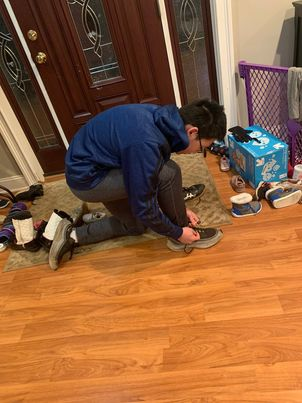 Freshman Daniel Qiu laces his sneakers to go for a run. “On Valentine’s day I did activities I enjoyed, such as watching Netflix and running,” Qiu said. “To me, love means keeping myself physically and mentally fit.”