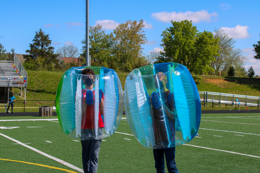 Prepping for their bubble soccer match, freshmen Ethan King and Santiago Criado get ready to go against the seniors, and subsequently, the juniors. Bubble soccer was a new event added this year, where players aim to score a soccer goal while being able to knock down opponents in their respective bubbles. “It was so much fun to combine the skill and teamwork side of soccer with [inflatable] bubbles, it was definitely a new experience for me,” King said.