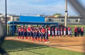 The Jefferson softball team lines up for assembly at Marshall High School during their game. It was their second game of the season, and it was postponed due to the weather. “It was kind of last minute, it wasnt a home game and it was kind of just all over the place a little bit,” sophomore Riley Cooper said.
