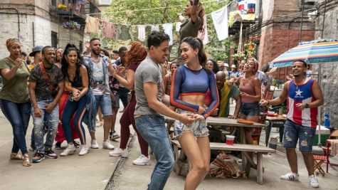 Everyone enjoys a backyard fiesta in “In The Heights”, seemingly unaware of the 100+ degree weather.