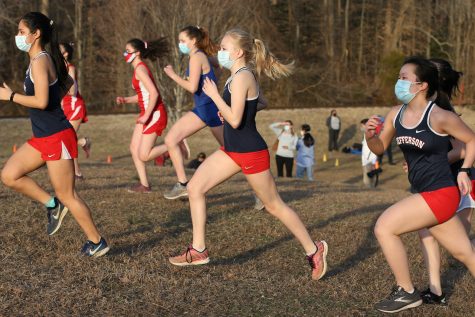 Junior Kaia Wright and other competitors raced with masks on in a spring 2021 cross country meet.