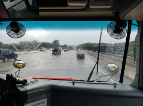 Bus 410 drives down I-495 in the after leaving late due to the torrential downpour.